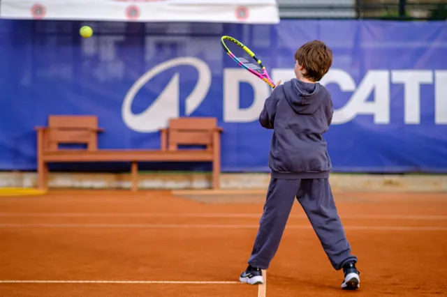Junior player practising a backhand on clay